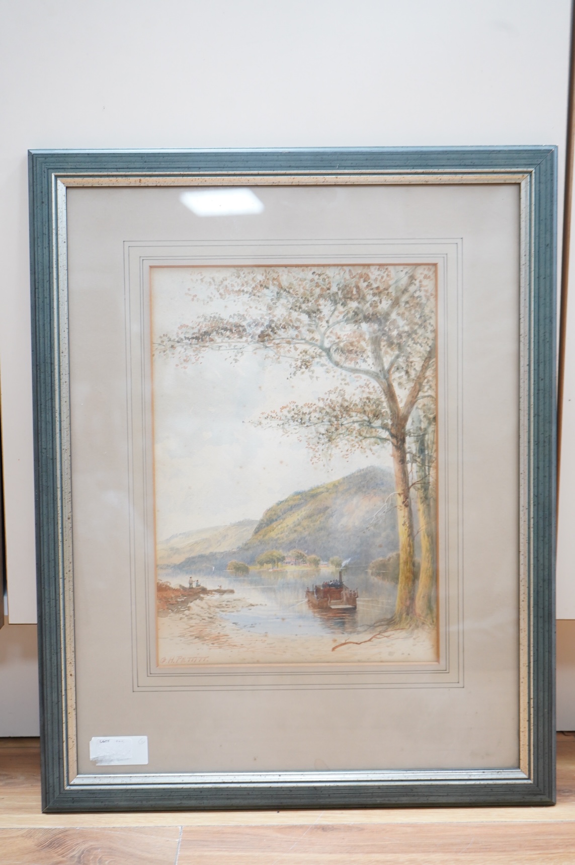 G H Pettitt (19th. C), Continental lakeside landscape with boats, signed, watercolour, 34 x 24cm